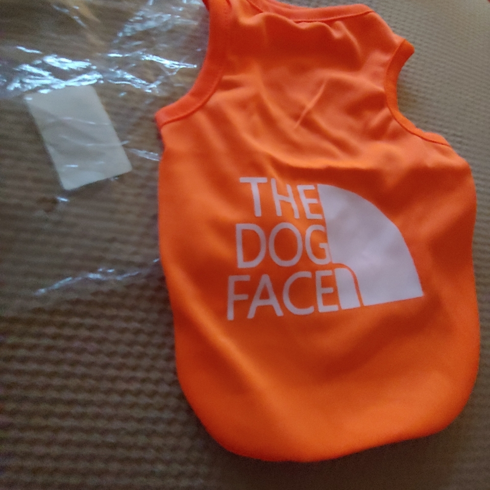The dog face t-shirt orange with with white lettering